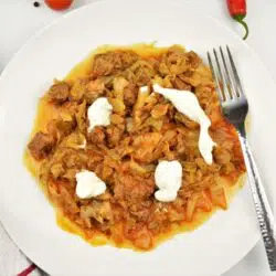 Beef and Cabbage Stew Recipe-Served on Plate With Sour Cream on the Top