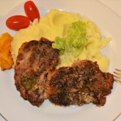 Easy Oven Baked Pork Steak Recipe-Served on Plate With Mashed Potatoes