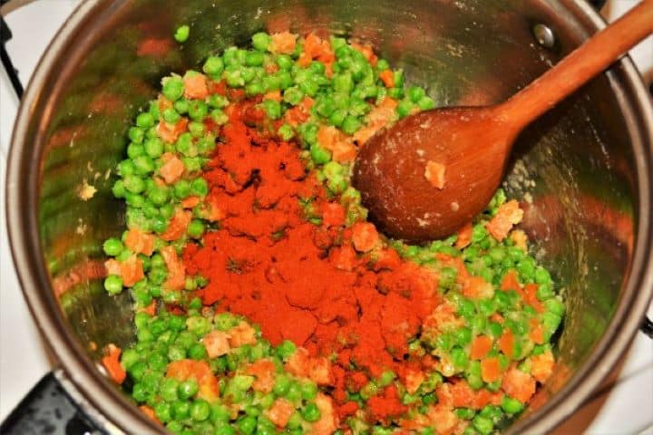 Paprika Powder on Frying Frozen Pea and Carrots in the Pot