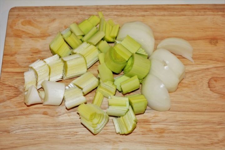 Coarsely Sliced Onion and Leek on the Chopping Board
