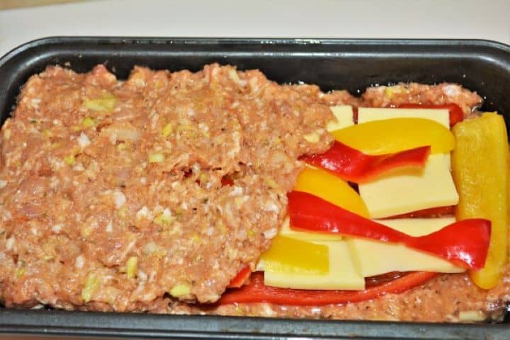 Covering the Stuffing With Rest of Meat Paste in the Loaf Pan