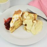 Best Simple Bread Pudding Recipe - Served on Plate With Custard and Raspberry Jam