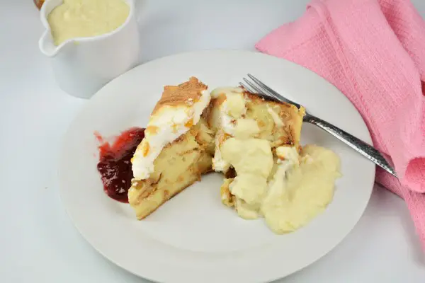 Best Simple Bread Pudding Recipe - Served on Plate With Custard Cream and Raspberry Jam