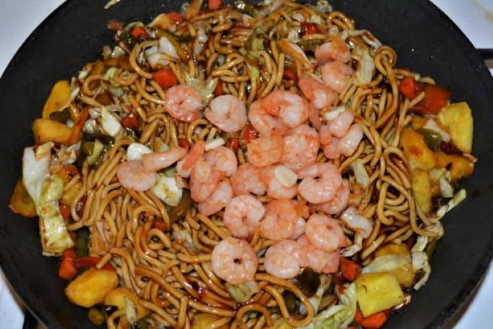 King Prawn Noodles Recipe - Add Fried Prawns on the Frying Egg Noodles Add Fried Prawns on the Frying Egg Noodles in the Pan