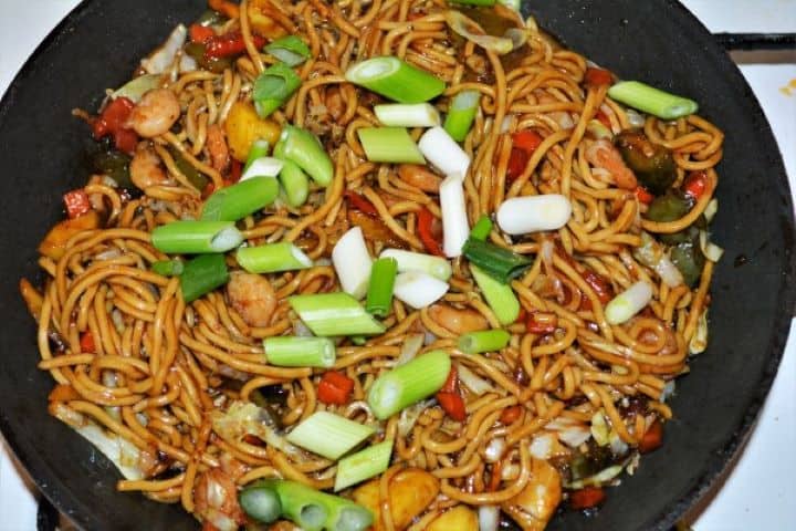 King Prawn Noodles Recipe - Add Sliced Spring Onions on the Frying Noodles Add Sliced Spring Onions on the Frying Noodles in the Pan