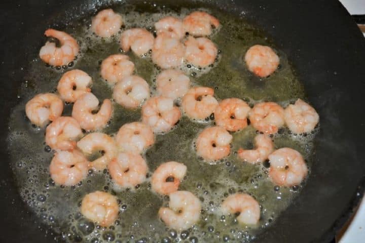 King Prawn Noodles Recipe - Frying King Prawns in the Pan Flash frying king prawns in a wok with olive oil for better texture