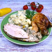 Baked Stuffed Whole Chicken Recipe-Served on Green Plate With Potato Salad
