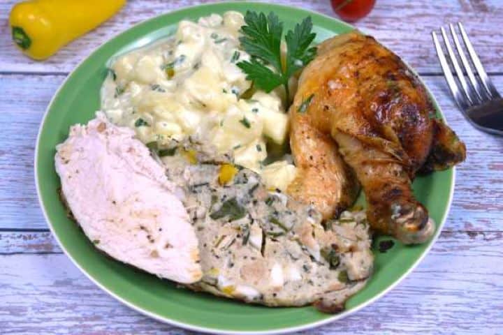 Baked Stuffed Whole Chicken Recipe-Served on Plate With Boiled Potatoes Baked Stuffed Whole Chicken Served on Green Plate With Potato Salad