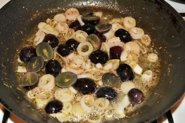 Best Turkey Tenderloin Recipe - Frying Sliced Shallots and Grapes in the Pan