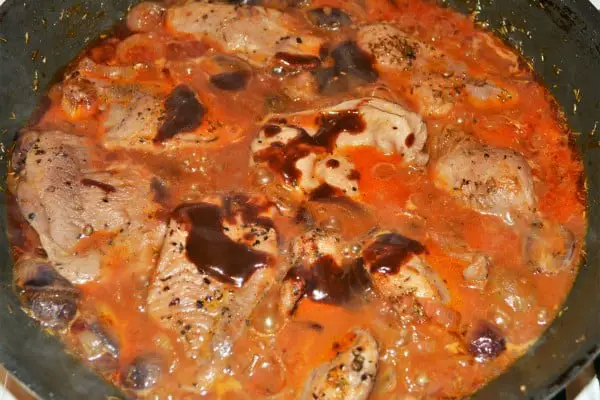 Best Turkey Tenderloin Recipe - Pouring BBQ Sauce in the Dish