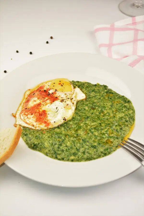 Quick Creamed Spinach Recipe - Served on Plate With Fried Eggs