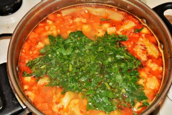 Best Healthy Cauliflower Soup Recipe-Bunch of Chopped Parsley in the Boiling Soup Bunch of Chopped Parsley in the Boiling Soup