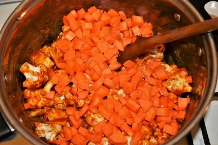 Best-Healthy-Cauliflower-Soup-Recipe-Carrots-Cut-in-Small-Cubes-Over-the-Cauliflower-Florets-in-the-Pot Carrots Cut in Small Cubes Over the Cauliflower Florets in the Pot