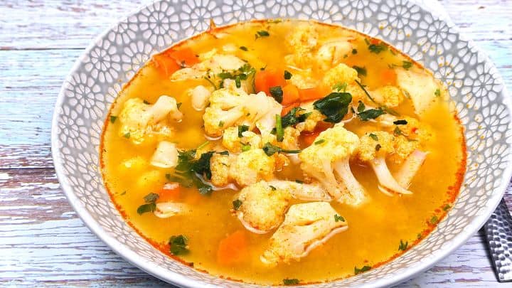 Best Healthy Cauliflower Soup Recipe-Served in Bowl With Sour Cream Authentic Transylvanian Cauliflower Soup Served Warm in a Bowl