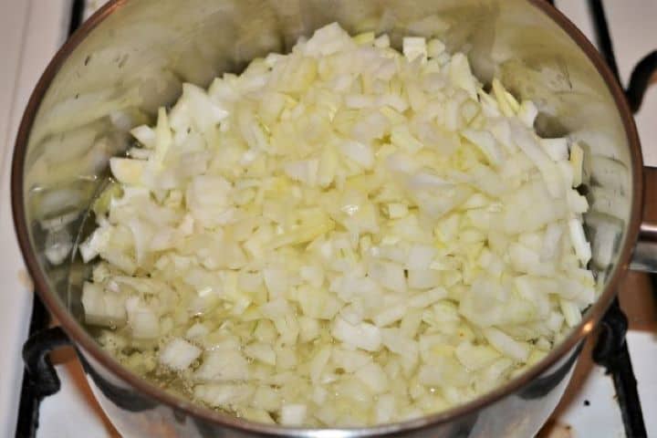 Easy Homemade Refried Beans Recipe-Chopped Onions in the Pot Frying Chopped Onions in the Pan