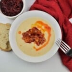 Transylvanian Mashed Beans Served on White Plate With Caramelized Onions