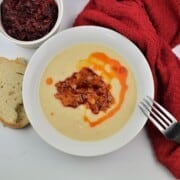 Transylvanian Mashed Beans Served on White Plate With Caramelized Onions