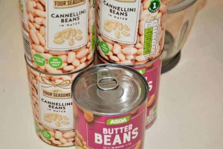 Easy Homemade Refried Beans Recipe-Canned Beans Six Canned White Beans on the Table