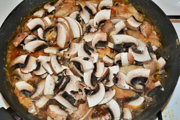 Easiest Teriyaki Chicken Recipe-Sliced Mushrooms in the Pan Over the Chicken Drumsticks