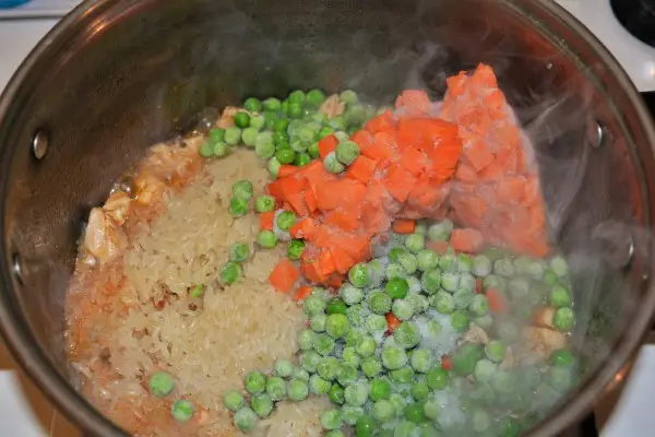 Simple Turkey Fried Rice Recipe-Washed Rice and Frozen Vegetables on the Turkey Stew