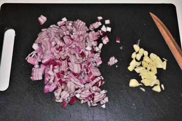 Best Chicken Casserole Recipe-Chopped Onion and Garlic on the Chopping Board