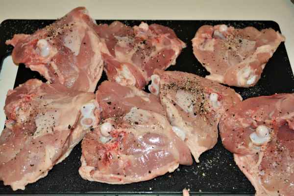 Best Chicken Casserole Recipe-Seasoned Chicken Thighs on the Chopping Board