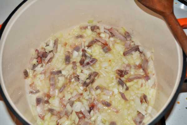 Pasta With Pork Mince Mushrooms and Double Cream-Frying Pancetta and Chopped Onion in the Pot