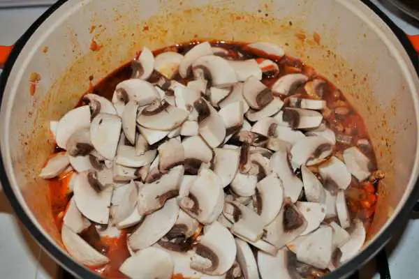 Pasta With Pork Mince Mushrooms and Double Cream-Sliced Mushrooms Over The Stew in the Pot