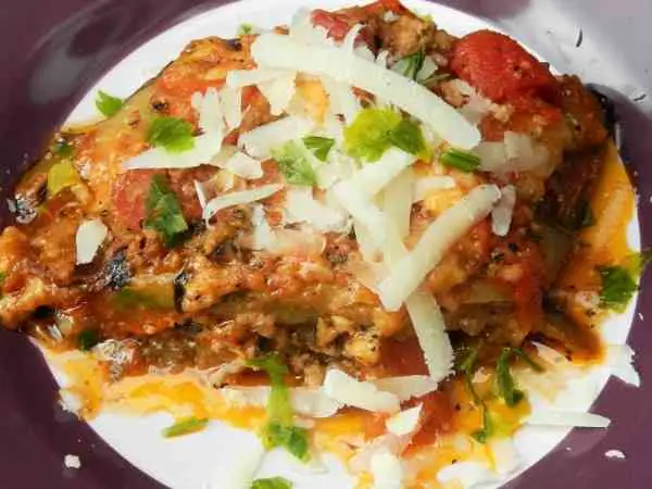 Best Eggplant Casserole Recipe-Served on Plate With Grated Pecorino on Top