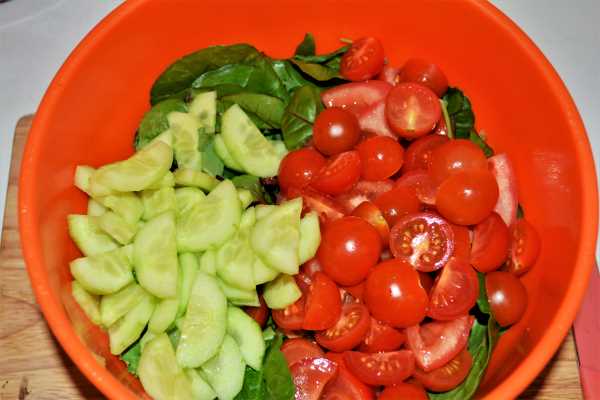 Easy Pan-Fried Steak Recipe-Salad Mix, Cut Tomato, Cut in Two Cherry Tomatoes and Sliced Cucumber in the Bowl