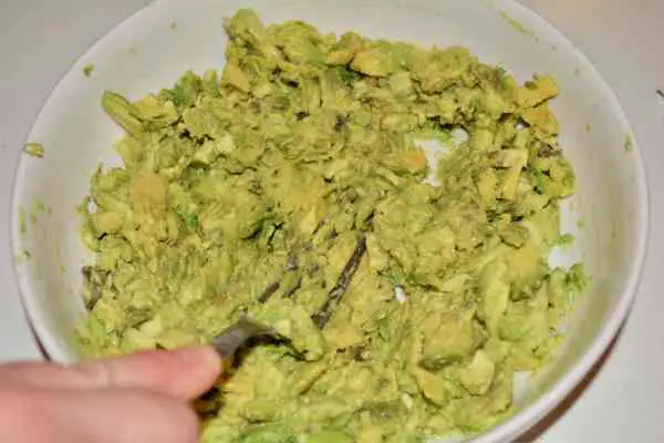 Best Homemade Guacamole Recipe-Mashed Avocados With a Fork