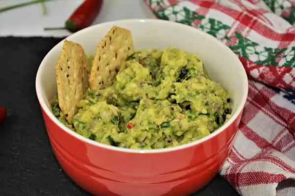 Best Homemade Guacamole Recipe-Served in Bowl With Crackers