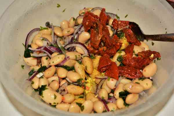 Butter Beans Salad Recipe-Chopped Sundried Tomatoes Over Ingredients in the Bowl