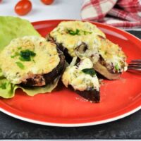Stuffed Mushrooms With Cheese and Bacon-Served on Plate With Lettuce Leave