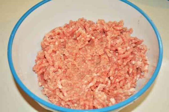 Easy Potato Moussaka Recipe-Pork Mince Fresh lean minced pork in a bowl for the savory moussaka meat filling.