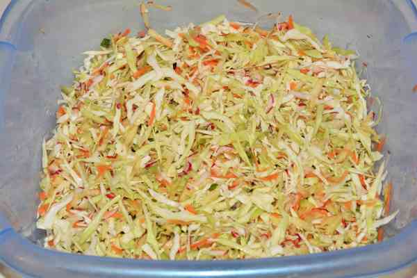 Mediterranean Cabbage Salad Recipe-Mixed and Salted Shredded and Grated Ingredients in the Bowl