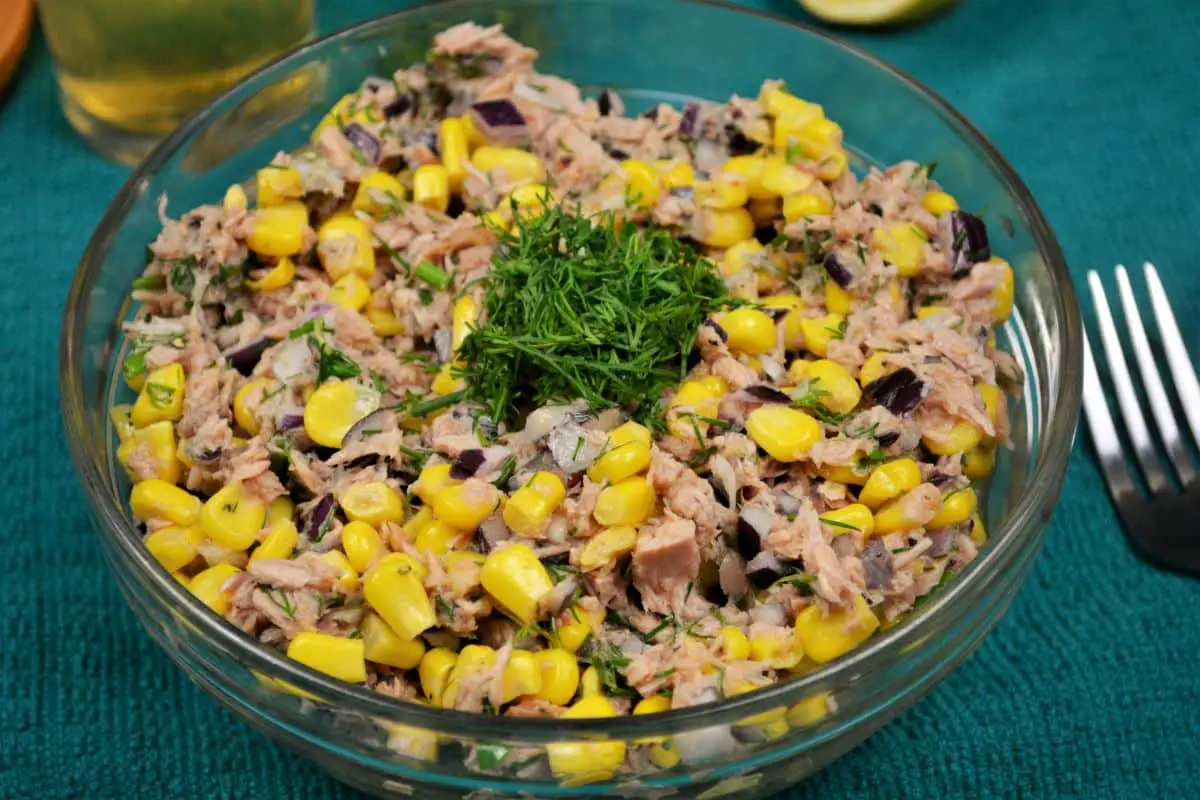 Tuna Corn Salad Recipe-Served in Bowl, With a Fork and a Glass of Beer