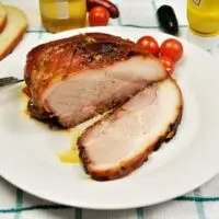 Slow Cooked Pork Shoulder in Oven-Sliced and Served on Plate With Mustard and Bread
