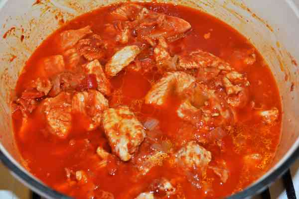 Turkey Cabbage Stew Recipe-Add Water on the Frying Turkey Fillet Cut in Cubes With Vegetables in the Pot