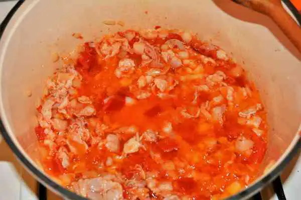 Turkey Cabbage Stew Recipe-Frying Chopped Onion, Bacon, Bell Pepper and Crushed Pepper in the Pot