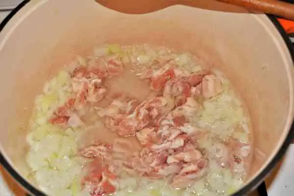 Turkey Cabbage Stew Recipe-Frying Chopped Onion and Bacon in the Pot