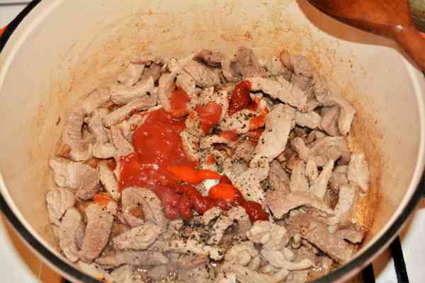Brasov Roast Recipe-Seasoning the Frying Pork Strips in the Pot 