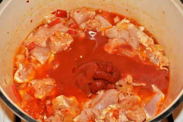 Turkey Cabbage Stew Recipe-Tomato Puree and Tomato Passata on the Frying Turkey Fillet Adding sweet Hungarian paprika, caraway, summer savory, and sweet pepper paste to the turkey meat.