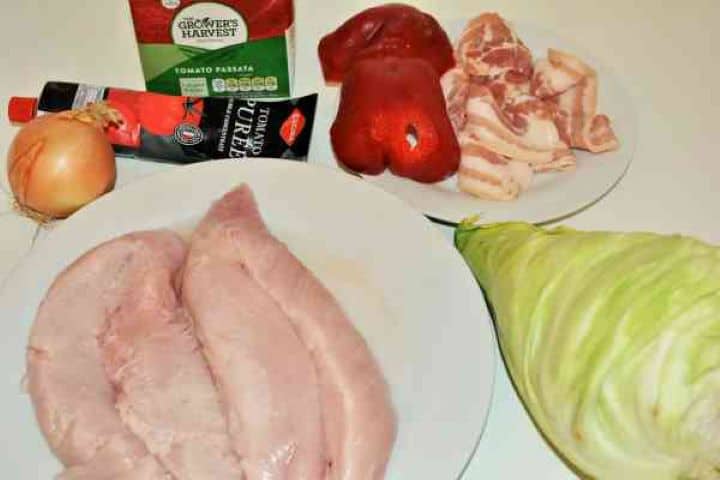 Turkey Cabbage Stew Recipe-Turkey Fillet, Cabbage, Onion, Bacon, Red Bell Pepper, Tomato Passata and Tomato Puree Ingredients needed for one-pot turkey cabbage stew recipe including cubed turkey, white cabbage, smoked bacon, bell pepper, and spices.