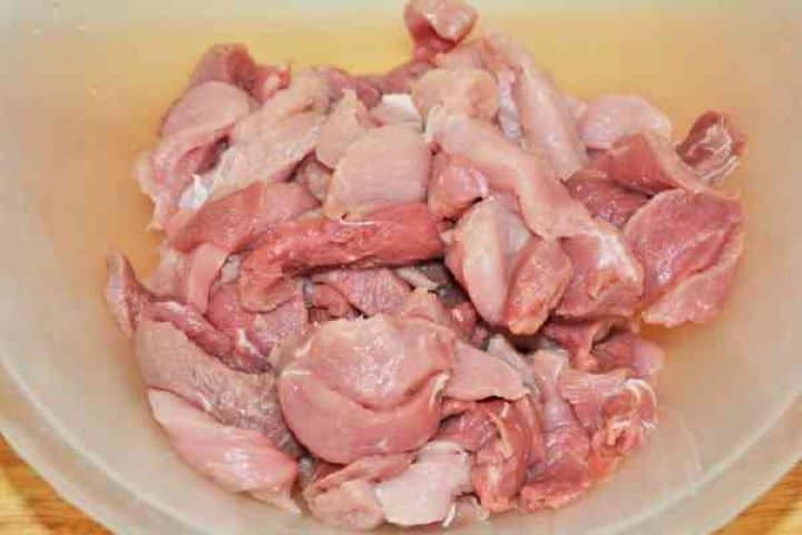 Brasov Roast Recipe-Pork Strips in the Bowl Fresh 650g pork shoulder cut into uniform 2 to 3 centimeter cubes for traditional Transylvanian Brassói aprópecsenye.