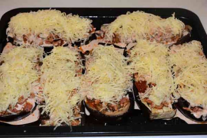 Stuffed Aubergines Recipe-Add Grated Cheddar on the Top of Stuffed Aubergines Add Grated Cheddar on the Top of Stuffed Aubergines