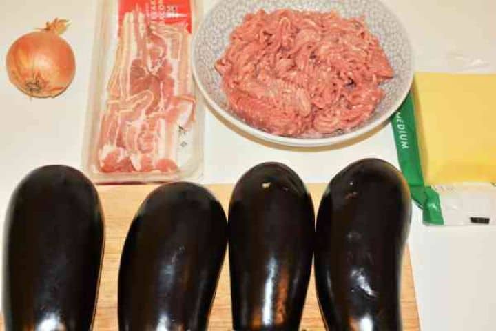 Stuffed Aubergines Recipe-Aubergines, Bacon, Pork Mince, Cheddar and Onion Aubergines, Bacon, Pork Mince, Cheddar and Onion on the Kitchen Table