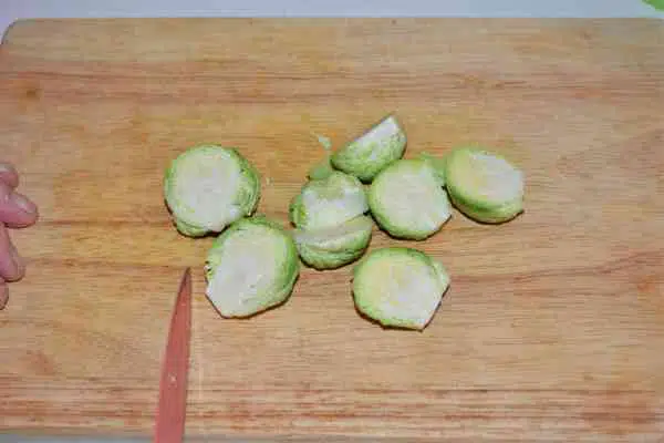 Brussels Sprouts With Lemon-Brussels Sprouts Cut in Two on the Chopping Board