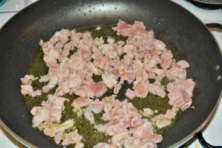 Brussels Sprouts With Lemon-Frying Bacon Strips in the Pan Frying smoked bacon strips with olive oil and black pepper in a non-stick skillet.