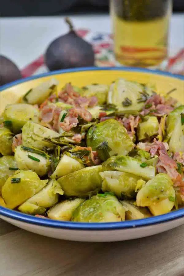 Brussels Sprouts With Lemon-Served in the Bowl on the Chopping Board With a Glass of Beer
